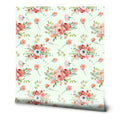 Watercolor floral wallpaper featuring coral and white flowers with green leaves on a light mint background.