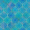 Blue Moroccan-inspired wallpaper with a repeating quatrefoil pattern outlined in metallic gold