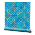 Blue Moroccan-inspired wallpaper with a repeating quatrefoil pattern outlined in metallic gold